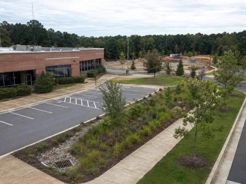 Stormwater design for a raleigh redevelopment site - Raleigh Civil Engineering Stormwater design with a landscaped bioretention area beside parking at a Raleigh redevelopment site